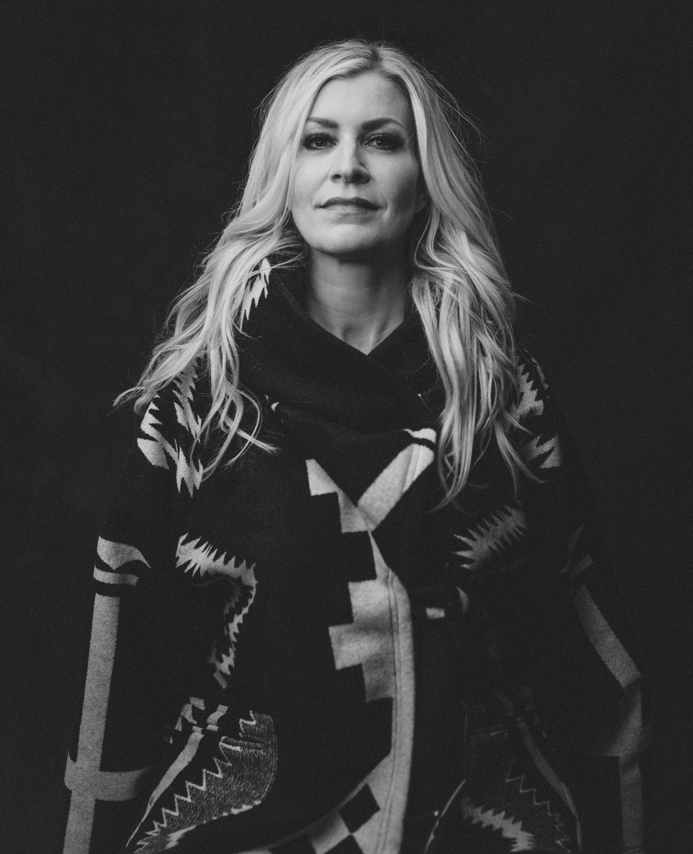 Black and white portrait of Jacy Ángelle Smith in a patterned wrap
