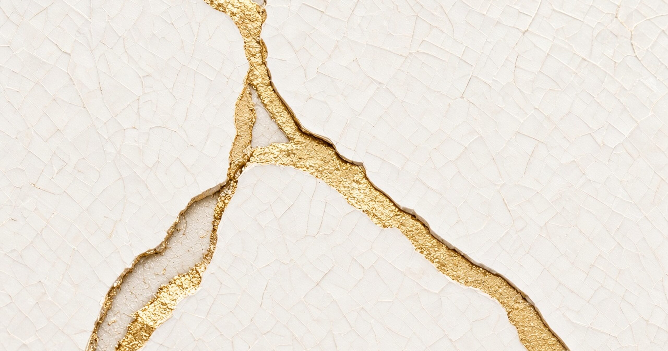 LUMINA, a cream surface with cracks mended in gold